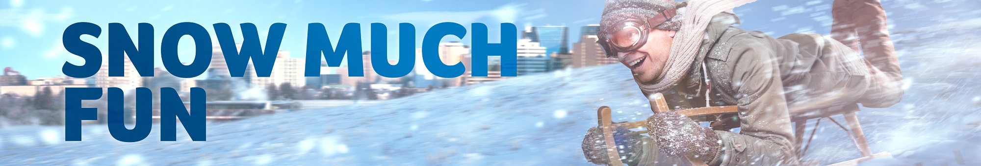 Caption: Snow Much Fun! Image of a person tobogganing on a snow hill